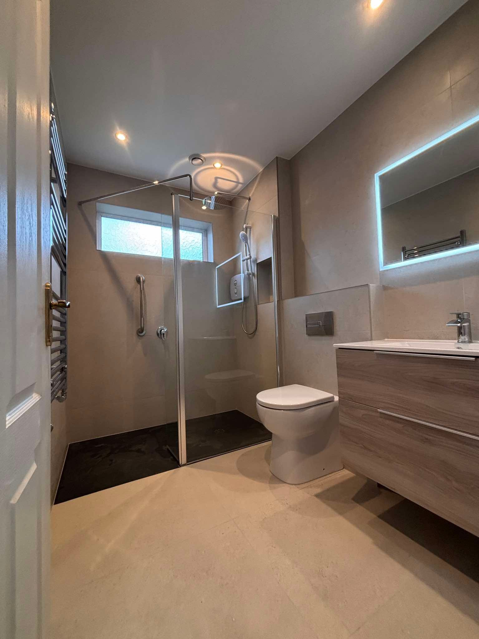 Modern bathroom fit-out with LED mirror and floating vanity unit, The Pipe Guy