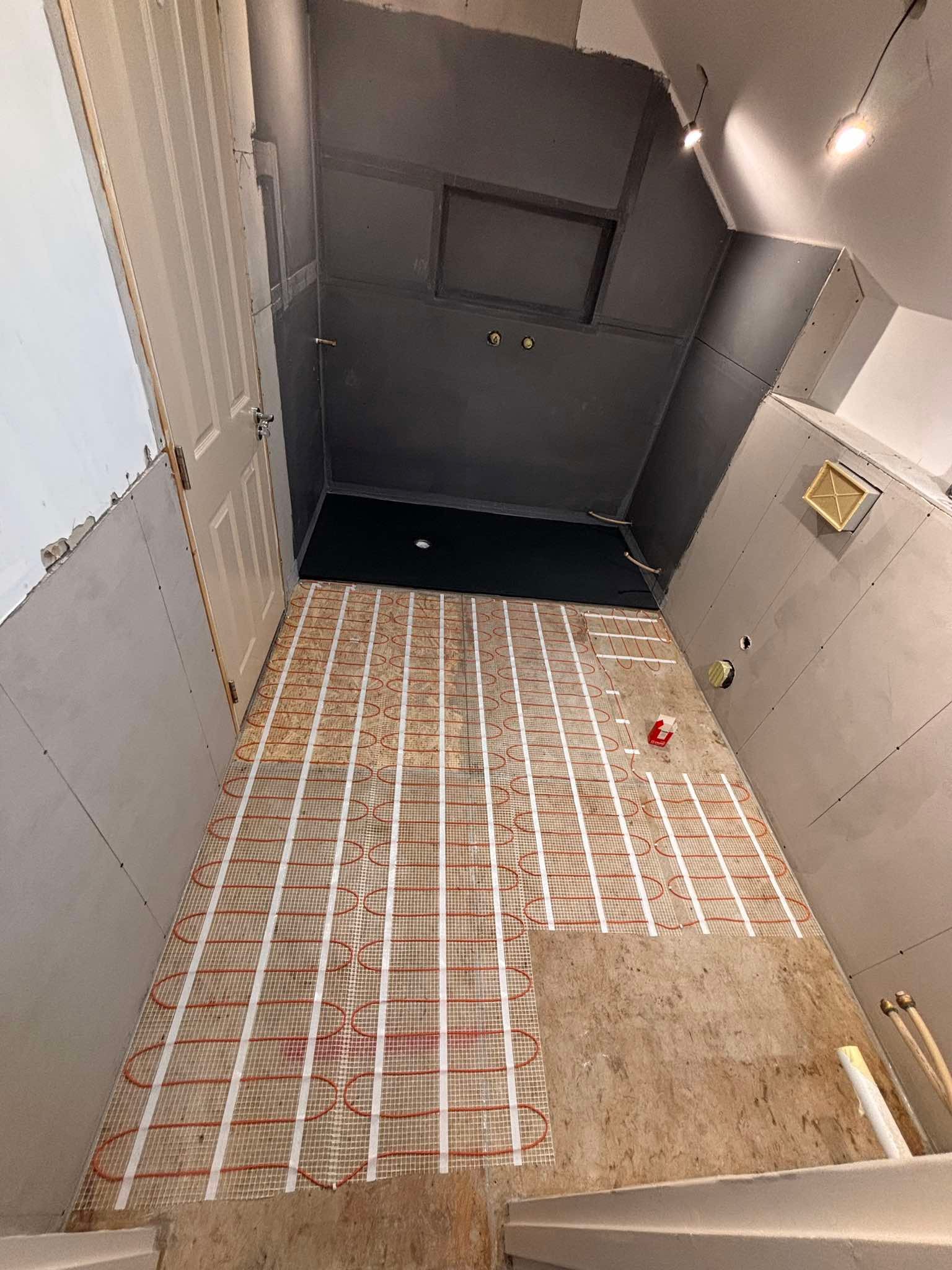 Underfloor heating mat laid during bathroom renovation, The Pipe Guy Kildare